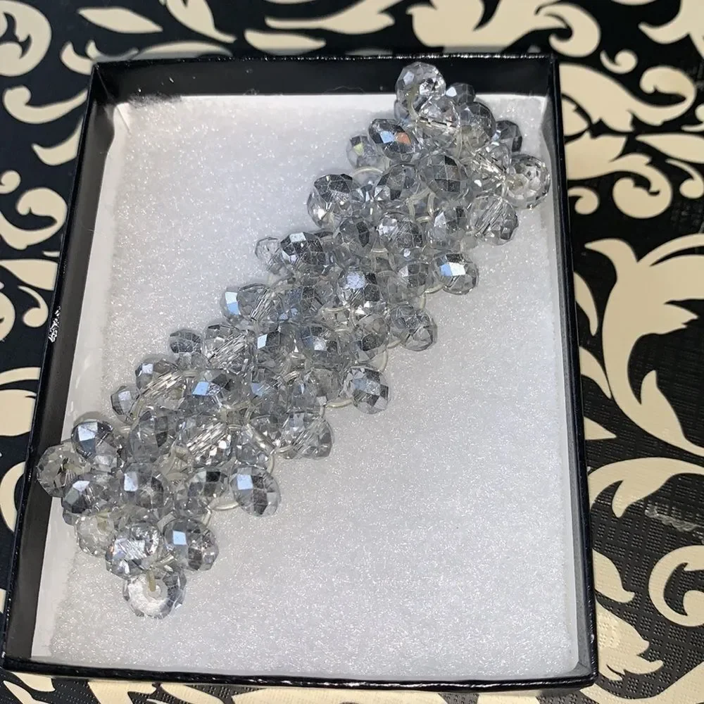 Clear, silver and iridescent beaded bracelet